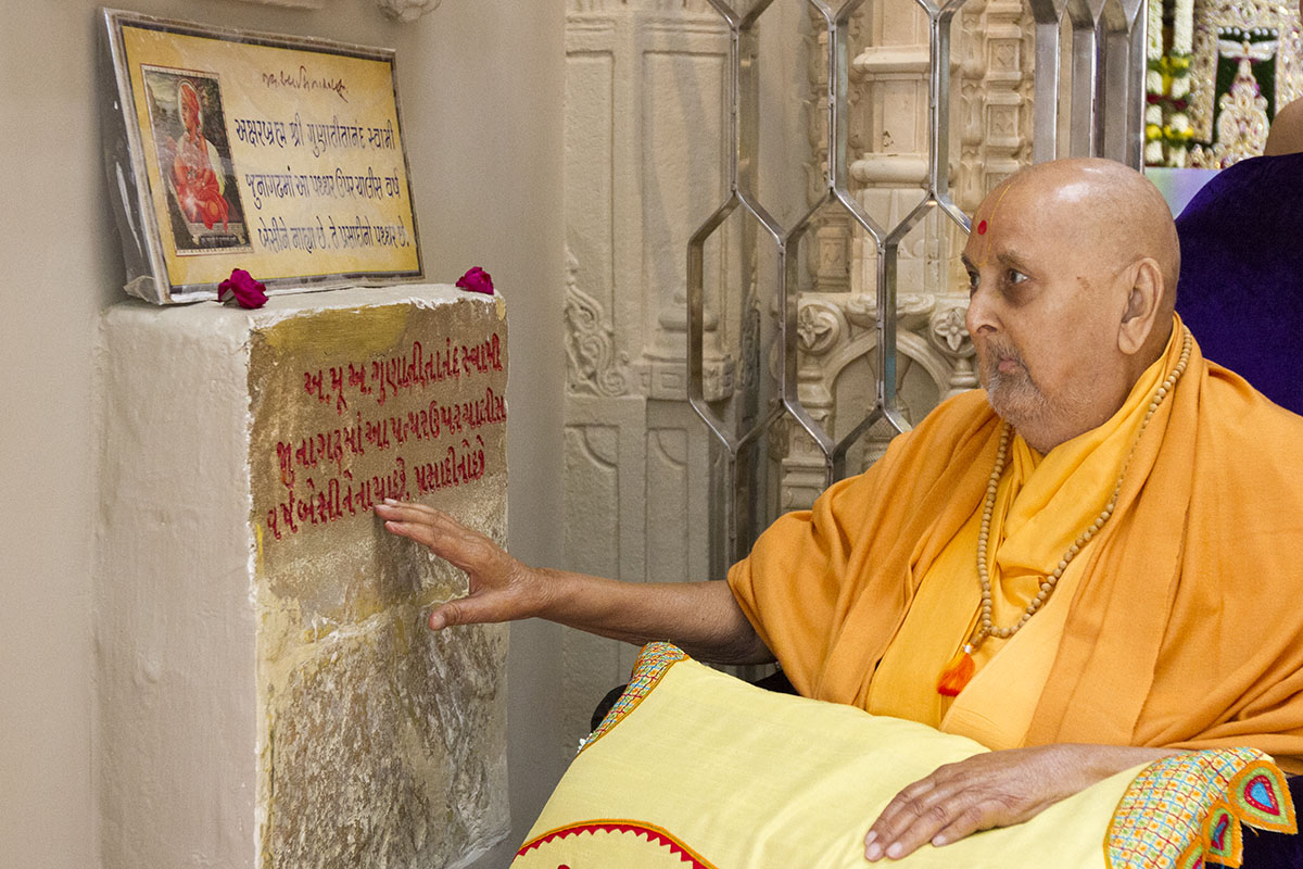 Swamishri reverentially touches sacred stone