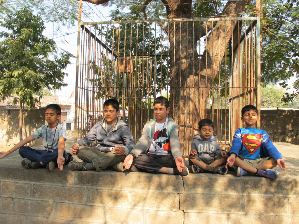 Balaks doing meditation at the school where Yogiji Maharaj studied as a child in Dhari, Gujarat
