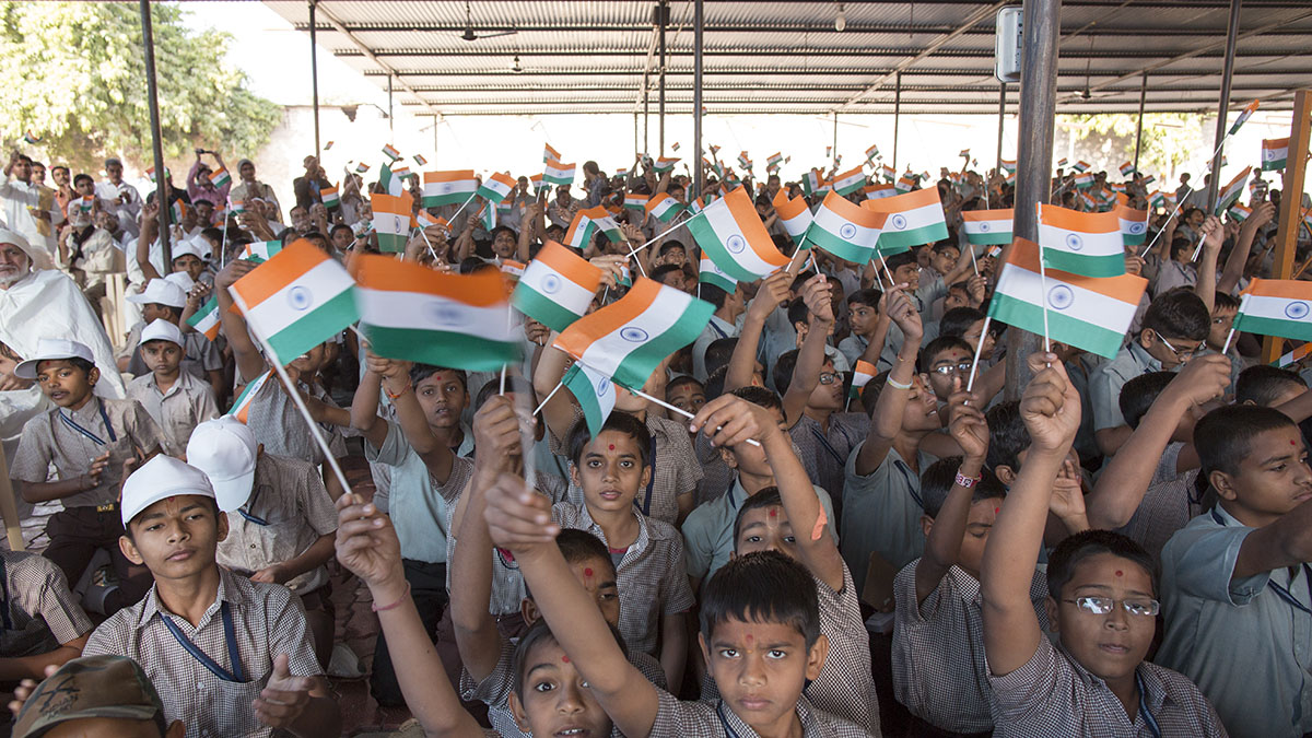 Students wave Indian tricolor flag
