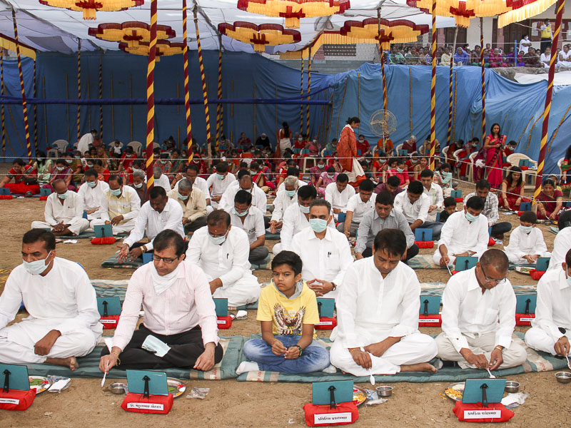 Devotees participate in mahapuja rituals