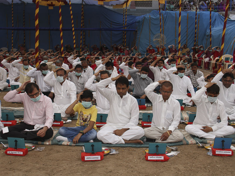 Devotees participate in mahapuja rituals