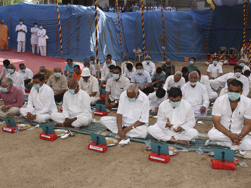 Devotees participate in mahapuja rituals
