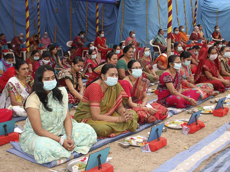 Devotees participate in mahapuja rituals