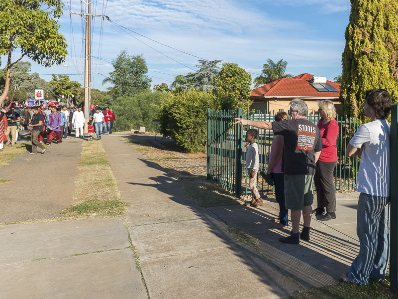 Residents of Adelaide observe the procession